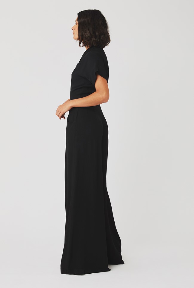 black jumpsuit with skirt