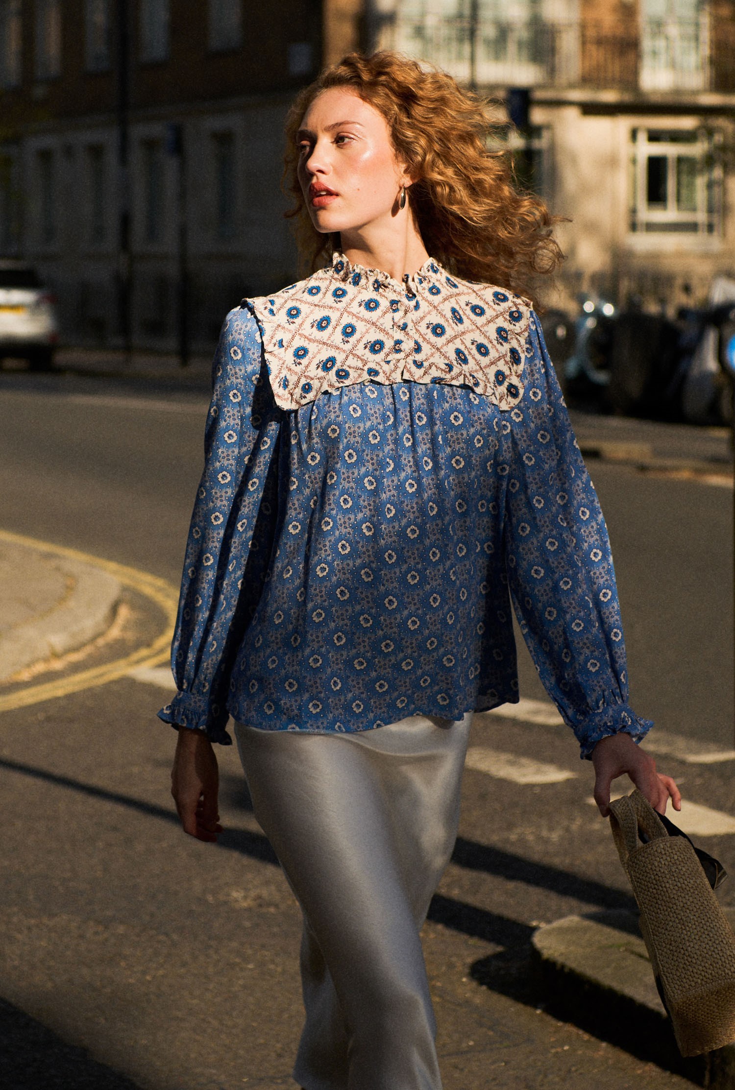 An image depicting Ghost Naomi Crepe Contrast Floral Blouse